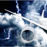 image of an airplane flying through a thunderstorm