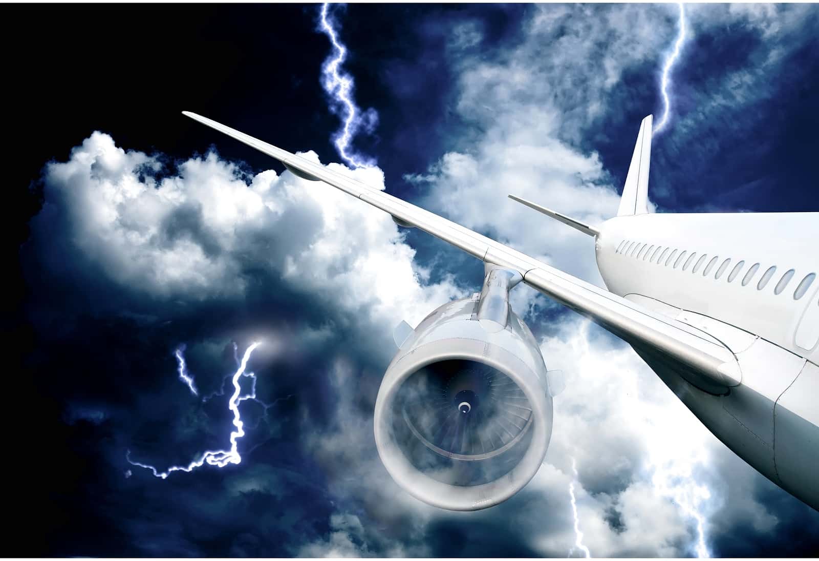 image of an airplane flying through a thunderstorm
