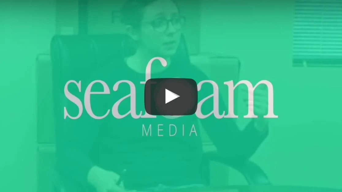 A thumbnail for a "Do I Need SSL?" media video featuring a woman in glasses sitting in an office chair, with the company's logo overlaying the image in a green tint.