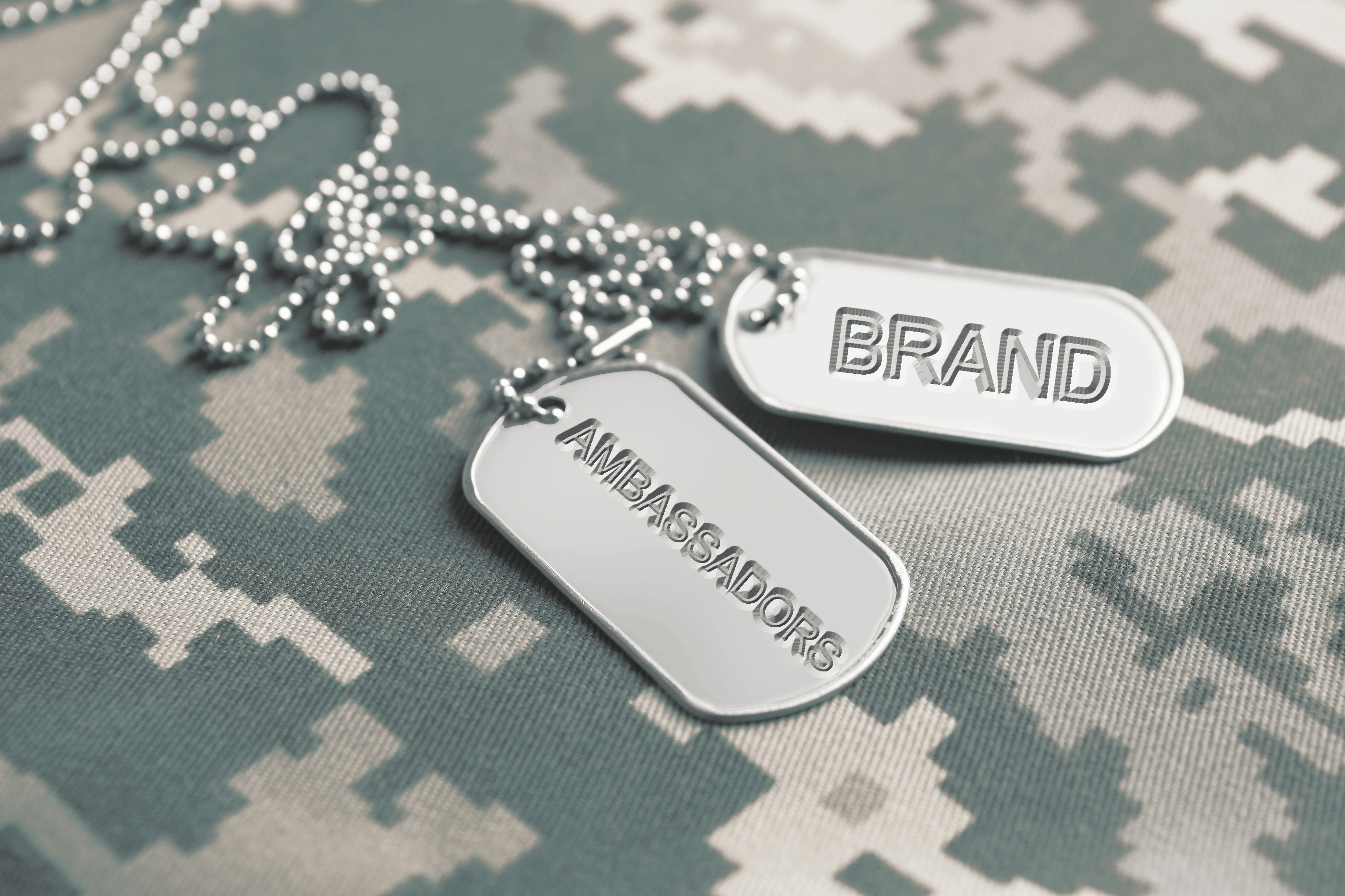 military dog tags with the words "brand ambassador" etched into them