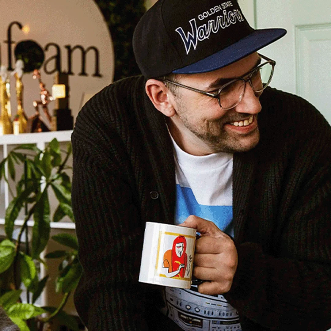 Seafoam team member with a coffee mug in the office