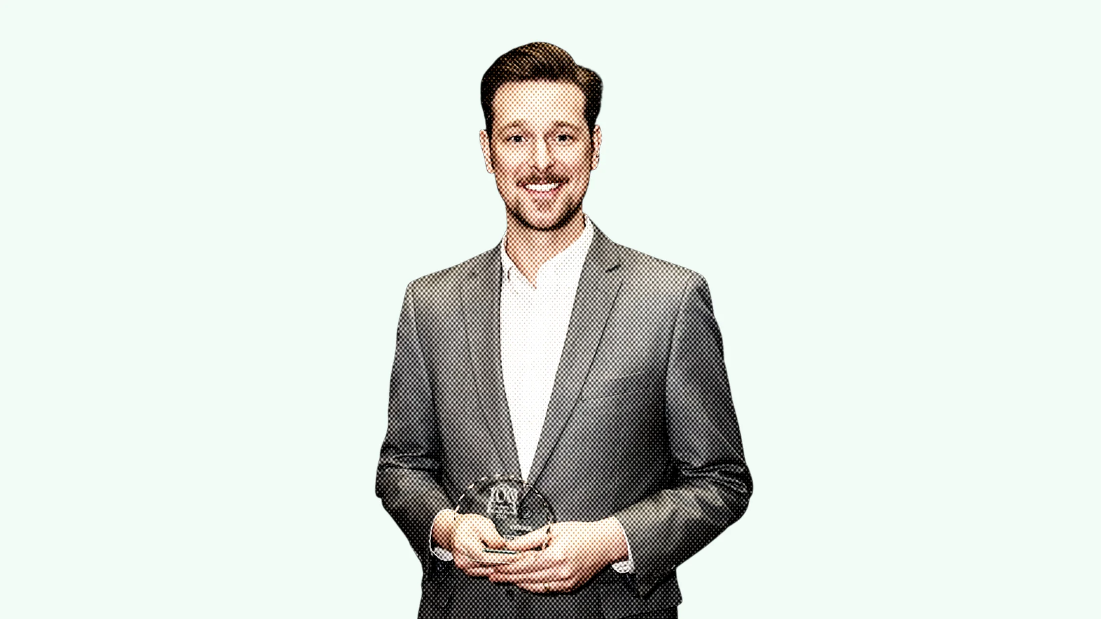 Ryan Foizey, St. Louis Small Business Monthly honoree, holding his award