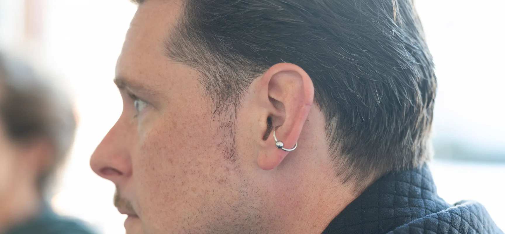 A Seafoam strategist listening closely during a client working session
