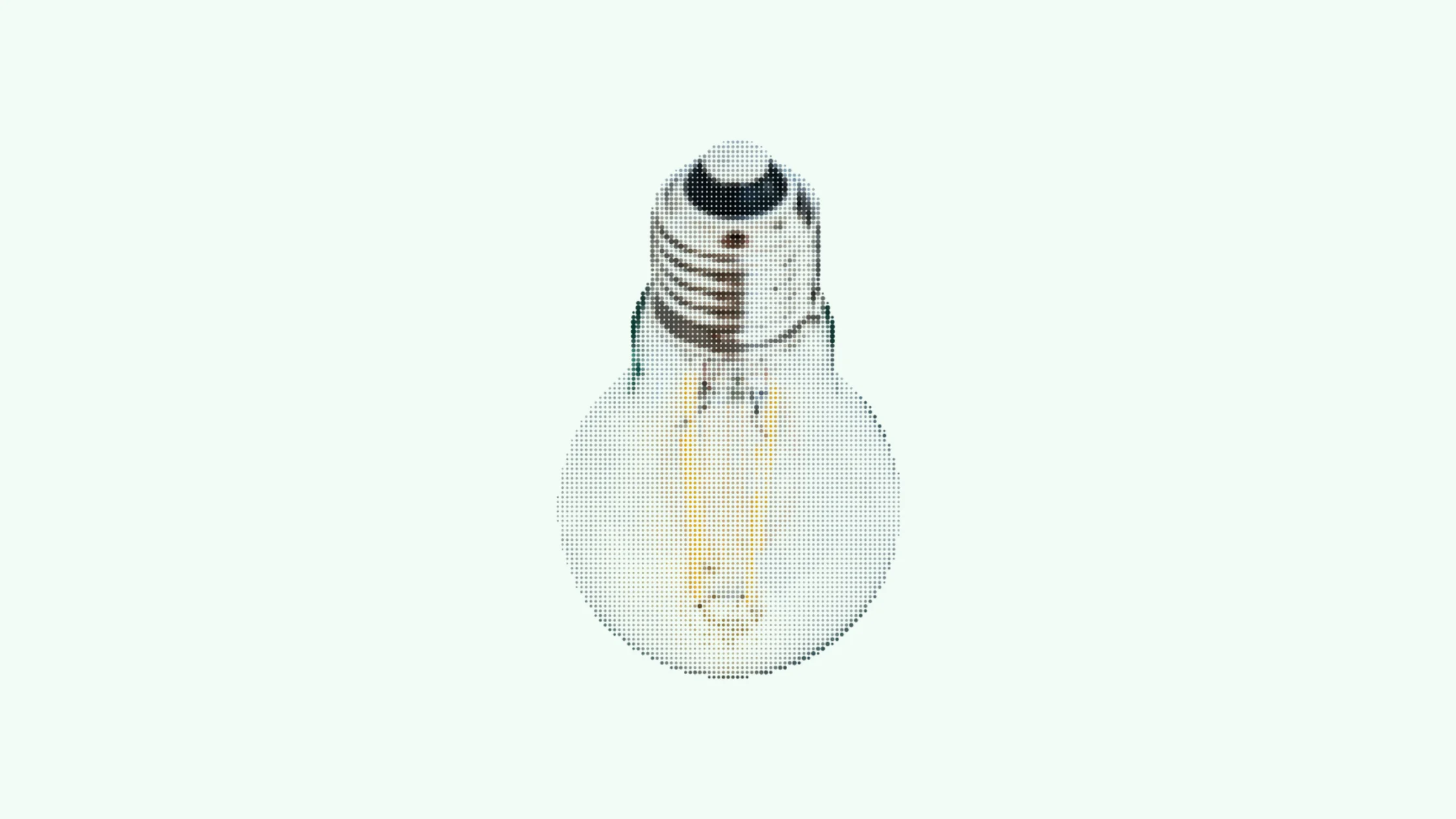 Detailed close-up of an incandescent light bulb on a textured gray surface, showcasing its filament.